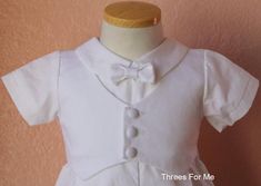 Baptism, Christening Cotton Romper OutfitOur Baptism outfit is Handmade by experienced handsJump suit and cap includedAll cotton gown, Keeping baby boy perfectly comfortable and fresh during Baptism Our jump suit is short sleeve with fold over collar. Hand sewed Cotton Bow tie. Vest has intricate texture and is sewed on jumpsuit.Pleaded romper pant design on pants.Button is back and bottom of pants make it easy to slip on baby boyMatching cap with elastic on back.Refunds/ ExchangeIf you have any Fitted Embroidered Sets For Baptism, Embroidered Fitted Baptism Dress For Summer, Fitted Embroidered Baptism Dress For Summer, Fitted Embroidered Baptism Dress For Spring, Formal Fitted Baptism Dress For Spring, Spring Baptism Dress Embroidered And Fitted, Fitted Embroidered Spring Baptism Dress, Summer Embroidered Fitted Baptism Dress, Spring Embroidered Fitted Baptism Dress