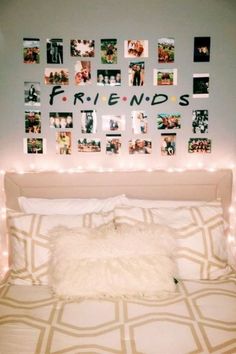 a white bed topped with lots of pictures and lights