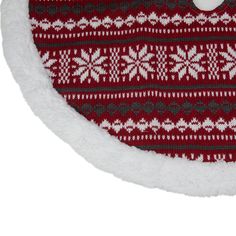 a red and white christmas ornament with snowflakes on it's side