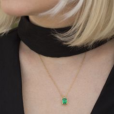 An Elegant and simply stunning Green Emerald necklace. This handmade piece of jewelry is set with a 8x6 Green Emereald Chatham in the deepest and most beautiful Colombian Green.. The setting itself is vintage inspired in its simplicity and holds the stone securely whilst allowing for maximum light to enter the stone. Hangs from a strong yet dainty vintage inspired oval link chain. Making & Shipping of this piece: Each item is made to order, please allow 4-7 days in normal times and 5-11 days Gold Jewelry With Bezel Setting For May Birthstone, Emerald Cut Gold Solitaire Necklace, Gold Emerald Pendant Necklace With Bezel Setting, Dainty Emerald Cut Yellow Gold Necklace, Classic Gold Emerald Birthstone Necklace, Gold Emerald Cut Necklace For May Birthstone, Gold Emerald Cut Emerald Necklaces, Gold Emerald Jewelry With Birthstone, Gold Emerald Necklace For Her