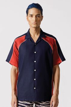 Half sleeve resort shirt crafted from navy cotton and red satin, featuring raglan sleeves and contrast piping in white. Fit: Comfort fitColor: NavyFabric: Cotton Blue Tops With Contrast Trim For Summer, Summer Shirt With Contrast Collar And Short Sleeves, Resort Shirt, Navy Fabric, Contrast Piping, Red Satin, Half Sleeve, Raglan Sleeve, Half Sleeves