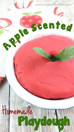 a homemade playdough made with apple scented dough and fresh green leaves on top