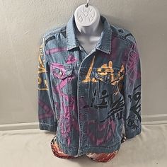 Graffiti Demin Jacket. Xs. Never Worn. 100% Cotton. Machine Washable. 6 Buttons Down Jacket. 4 Pockets On Front. Butterfly On Back. "Love Is The Answer" Is Pront On The Front, Back And Arms Several Times. Casual Blue Outerwear With Graffiti Print, Blue Long Sleeve Outerwear With Graffiti Print, Urban Purple Outerwear For Fall, Trendy Long Sleeve Outerwear With Graffiti Print, Casual Fitted Outerwear With Graffiti Print, Fitted Graffiti Print Outerwear For Spring, Spring Blue Outerwear With Graffiti Print, Fitted Purple Outerwear For Streetwear, Casual Purple Relaxed Fit Outerwear