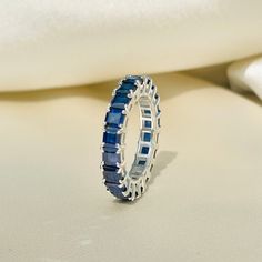 Blue Sapphire Eternity Band, Sapphire Eternity Ring, Minimalist Ring, Stackable Ring, Wedding Band, Gemstone Ring, Gift Idea, Gift for Her Diri Jewels 1. Product Details ✧ Material : High Quality Solid 925 Sterling Silver ✧ Color Options: 14K Gold, 14K White Gold ✧ Stone Type: Simulated Blue Sapphire 2. Shipping & Packaging Details ☐ Dispatches in 4 - 8 business days ☑ Multiple shipping speeds available 3. Custom Orders Its simple, just get in touch with us and we'll take care of the rest. 4. Re Sapphire Eternity Band Stacked, Hand Goals, Blue Sapphire Eternity Band, Eternity Band Stack, Sapphire Band Ring, Sapphire Eternity Band, Sapphire Eternity Ring, Sapphire Wedding Rings, Sapphire Wedding Band