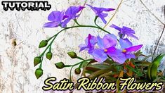 a potted plant with purple flowers in it and the words, satin ribbon flowers