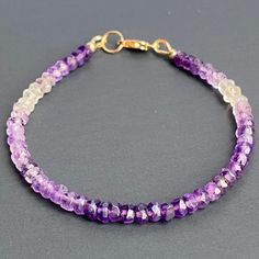 Beautiful Dainty Bracelet Made With Genuine Purple Amethyst And 14k Gold Filled Metal Gemstone: Ombr Shade Natural Purple Amethyst Metal: 14k Gf February Birthstone Tags: Jewelry/ Women/ Gift/ Healing/ Crystal/ Boho/ Chic/ Dainty/Unique/ Gems/ Gem/ Natural/ Genuine/ Authentic/ Stone/ Gold/ Silver/ Gypsum/ Y2k/ Handmade/ Custom/ Her/ Girl/ Mom/ Grandma/ Birthday/ Birthstone/ Dainty/ Fashion/ Stylish/ Girlfriend/ Anniversary/Vintage/ One Of A Kind/ Unique/ Amethyst Yellow Gold Bracelets With Gemstones, Yellow Gold Bracelets With Amethyst Gemstone, Yellow Gold Amethyst Bracelets With Gemstone, Yellow Gold Amethyst Gemstone Bracelets, Elegant Purple Rondelle Bracelets, Purple Amethyst Birthstone Bracelet, Purple Amethyst Rondelle Bracelets, Purple Rondelle Amethyst Bracelets, Purple Bracelets With Natural Stones