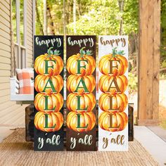 three wooden signs with pumpkins and happy fall written on them sitting on a porch