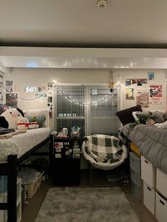 a dorm room with bunk beds and pictures on the wall