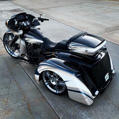 a black and silver motorcycle parked on the street