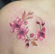 a woman's breast with pink flowers on it