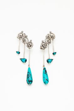 Playful, fierce, elegant. The turquoise colored stones give complexity to these earrings looking like little bow and arrows falling down your ear for an edgy look. Colored Stones, Perfect Wardrobe, Edgy Look, Turquoise Color, Falling Down, Lady Gaga, Kendall Jenner, Ring Bracelet, Layered Necklaces