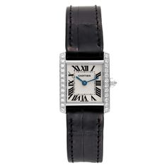 Cartier Tank Francaise White Gold Diamond Ladies Watch WE100251. Quartz movement. Rectangular 18k white gold 20.0 x 25.0 mm case. Octagonal crown set with an original Cartier factory diamond. 18k White gold original Cartier factory diamond bezel. Scratch resistant sapphire crystal. Silver dial with black radial Roman numerals. Sword shaped blued steel hands. Secret Cartier signature at X. Black leather strap with 18k white gold deployant buckle. Cartier Designer Diamond Watch, Designer Cartier Diamond Watch, Designer Diamond Cartier Watch, Cartier Diamond Watch With Polished Finish For Formal Occasions, Timeless Cartier Diamond Watch With Palladium Hardware, Designer Cartier Diamond Watch With Diamond Hour Markers, Classic Watch With Diamond Accents And Rectangular Dial, Cartier Designer Diamond Watch With Diamond Hour Markers, Classic Diamond Watch With Palladium Hardware