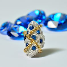 This stunning handcrafted ring is a true work of art, featuring a unique design that combines luxurious silver with deep blue spinel gemstones. The intricate detailing of the silver band is accentuated by the vibrant sparkle of the gemstones, creating a piece that is both bold and elegant. Perfect for adding a touch of sophistication to any outfit, this ring is ideal for those who appreciate fine craftsmanship and unique jewelry. Whether for a special occasion or everyday wear, this ring is sure to make a statement. Additional information Weight 23g Gemstone Spinel Material Silver 925 Length 36mm Plating Gold Plating 24K Handmade Jewelry It is hallmarked with my maker's mark and the .925 . Size: 6 1/2 & 7  This design (Size: 6 1/2 & 7 )  is ready to ship in 1 - 3 business days. If you need Blue Spinel, Spinel Gemstone, Handcrafted Rings, Silver Band, Rings Statement, Artisan Jewelry, Favorite Things Gift, Deep Blue, Silver 925