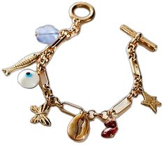 a gold bracelet with charms and seashells is shown on a white background in this image