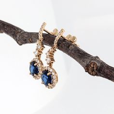 These sparkly blue sapphires are stunning in this pair of dangly earrings with zig-zag offset natural diamond accents. The sapphires are held in place by a prong setting and the earrings are pushback making them secure for daily wear! Show off these stunning gems on any special occasion. Phone Items, Blue Gems, September Birthstone, Dangly Earrings, Halo Diamond, Prong Setting, Daily Wear, Blue Sapphire, Natural Diamonds