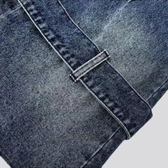 the back side of a pair of jeans with an open pocket on one side and two pockets on the other