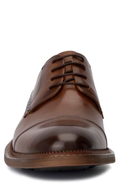 A classic cap toe brings a polished aesthetic to a contemporary derby made of supple leather. Lace-up closure Cushioned footbed Cap toe Leather upper and lining/rubber sole Imported | Vintage Foundry Cyrus Cap Toe Leather Derby Business Derby Oxford Shoes With Cap Toe, Classic Snip Toe Oxfords For Derby, Classic Snip Toe Dress Shoes For Derby, Brown Dress Shoes With Rubber Heel Cap For Derby, Timeless Cap Toe Dress Shoes For Derby, Timeless Business Casual Cap Toe Lace-up Shoes, Cap Toe Dress Shoes With Goodyear Welt For Derby, Fitted Cap Toe Leather Shoes For Derby, Cap Toe Goodyear Welted Derby For Workwear