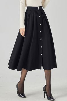 Elegant and timeless, this wool maxi skirt is a must-have addition to your wardrobe. Crafted with care and attention to detail, this skirt features a button front closure for added style. Whether you're heading to the office or going out for a night on the town, this handmade skirt will elevate any outfit. Pair it with a blouse and heels for a sophisticated look, or dress it down with a sweater and boots for a more casual vibe. 

#elegance #woolmaxiskirt #handmade #fashion Simple Skirts, Office Skirts, Elegant Winter Skirt With Buttons, Buttoned A-line Skirt, Fitted Chic Maxi Skirt With Buttons, Fall A-line Skirt With Buttons, Chic A-line Skirt With Buttons, Maxi Skirt And Boots, Wool Dress Outfit