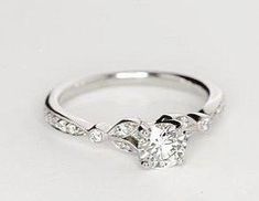 a diamond ring with three stones on it