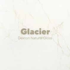 a close up of a white marble wall with the words glazier written on it