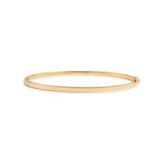 This is part of Chairish’s Fine Jewelry assortment.  Gender: Ladies  Metal Type: 18K Yellow Gold  Length: 6.00 mm  Width: 2.25 mm  Weight: 10.10 Grams  18K yellow gold sapphire bangle bracelet. The metal was tested and determined to be 18K yellow gold. Engraved with "18K". The "Reign" trademark (or hallmark) can also be found on the item.  Pre-owned in excellent condition. Might show minor signs of wear.  Pavé set in 18 Karat Yellow Gold with:  Thirty-six (36) natural, round-shaped, brilliant cu Elegant Yellow Gold Bangle For Everyday, 14k Gold Bangle With Polished Finish For Everyday Luxury, Fine Jewelry Gold Bangle Bracelet With Polished Finish, Classic Everyday Luxury Bangle With 17 Jewels, Classic Tarnish Resistant Diamond Bangle Bracelet, 14k Yellow Gold Bangle For Everyday Luxury, Classic Gold Bangle Bracelet For Formal Occasions, Classic 14k Gold Bangle For Formal Occasions, Formal 14k Gold Stackable Bangle