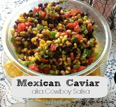 mexican caviar with black - eyed peas, corn and tomatoes in a glass bowl