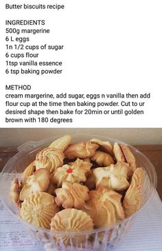 a bowl filled with cut up cookies on top of a wooden table next to a recipe sheet