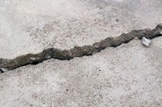 Concrete slabs can settle and shift, and may need repair. Learn how much it costs to level a slab for a patio, driveway, or foundation. Concrete Calculator, Broken Concrete, Foundation Repair, Paver Driveway, Concrete Driveways, Concrete Slab