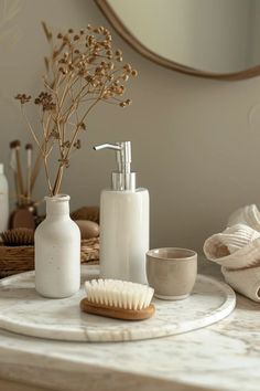 the bathroom accessories are arranged on the table