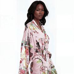 Experience the Beauty of the Peach Garden Floral robe The Peach Garden floral robe combines soft peach tones with vibrant floral prints for an elegant touch. Perfect for lounging or unwinding, this floral robe offers a luxurious feel with effortless style. Elegant long sleeve, long robe, kimono with invisible side seam pockets. Exclusive QWR pattern features a soft peach hue with oversized bold floral peony patterns in red, yellow and green florals for a fresh, garden-inspired look. Prominent co Feminine Floral Print Robe For Loungewear, Pink Floral Print Kimono For Loungewear, Floral Print Kimono Sleeves Sleep Robe, Pink Spring Robe For Relaxation, Pink Spring Kimono For Home, Pink Feminine Robe For Spring, Floral Print Sleepwear With Kimono Sleeves, Pink Robe For Spring Relaxation, Pink Kimono For Home During Spring