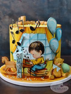 a cake decorated with a boy playing the piano