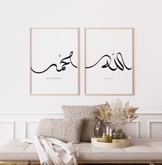 two black and white art prints on the wall above a couch in a living room