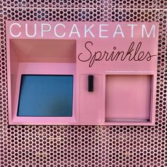 a pink cupcake atm machine with the words sprinkles on it