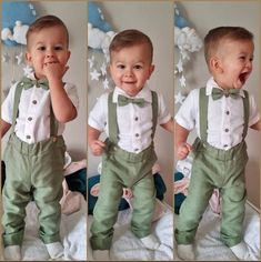 a little boy that is standing up in some green pants and suspenders with his mouth open