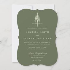 the rustic pine tree wedding card is shown in green, with white ink on it