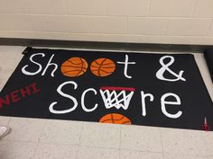 a sign that says shot and score with basketballs on it in front of a wall