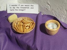 a bowl of fries next to a sign that says i wonder if you would like to dip the breadsticks and taste the vinegar?