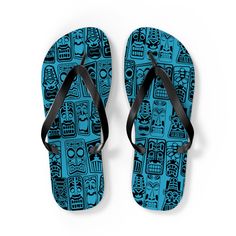 Retro Tiki Hawaii Sky Blue Unisex Tropical Flip-Flops Let your feet breathe! With a high quality print, these Flip Flops are a must have item on the beach, around the house or to brighten up a special outfit on hot summer days. .: 100% Rubber .: Multiple sizes .: Textured black thong strap .:IMPORTANT!  Runs bigger than usual Non-slip Blue Flip Flops For Swimming, Blue Graphic Print Swimwear For Poolside, Casual Blue Non-slip Flip Flops, Blue Graphic Print Swimwear, Blue Flip Flops For Beach Season, Blue Flip Flops For Swimming And Beach Season, Blue Non-slip Casual Flip Flops, Casual Blue Flip Flops For Pool, Blue Flip Flops For Swimming During Beach Season