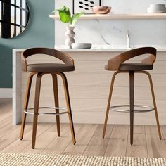 two modern bar stools in front of a counter