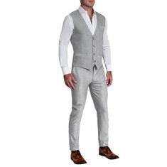 Our heathered light grey stretch suit vest is crafted from a performance fabric blend that is extremely stretchy while still providing an incredibly professional appearance. This vest is lined with our dress shirt fabric making it lightweight, breathable, and moisture-wicking. It also features our signature athletic fit that rewards those with an athletic physique. Vest design details: Single-breasted 4-button closure Rear adjustment clinch Jetted pockets Tortoise shell buttons and buttonhole st Fitted Spring Suit With Vest, Fitted Gray Suit For Spring, Gray Fitted Vest For Business, Classic Gray Formal Vest, Fitted Gray Vest For Business, Classic Tailored Gray Vest, Gray Tailored Vest For Business, Fitted Gray Vest For Workwear, Gray Sleeveless Vest For Formal Occasions