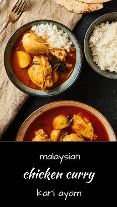 malaysian chicken curry with rice in bowls on a black tablecloth next to silverware and utensils