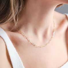 LINK - NECKLACE Elevate your everyday style with our exquisite Paperclip Chain Necklace. Crafted with precision and elegance, this dainty necklace features a timeless paperclip chain design, made from high-quality 925K silver and plated with luxurious 18K gold and Rose Gold. Versatile and chic, it effortlessly transitions from day to night, making it the perfect accessory for any occasion. Whether you're treating yourself or searching for the ideal gift for a loved one, our necklace exudes sophi Gift Clavicle Chain Necklace With Paperclip Shape, Gift Paperclip Clavicle Chain Necklace, Holly Springs Nc, Paperclip Chain Necklace, Paperclip Necklace, Silver Paper, Layered Chains, Link Chain Necklace, Chain Design