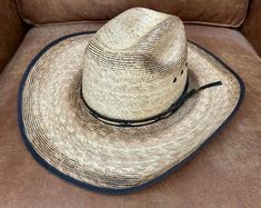 This Jason Aldean Resistol cowboy hat is a must-have for any western enthusiast. Made with natural materials and featuring a verde bound palm leaf and cattleman crease, this hat is both stylish and functional. Perfect for unisex adults, this hat is available in size 7 and is sure to be a hit at any Jason Aldean concert. The hat is perfect for those who love the western theme and want to show it off in style. Jason Aldean Concert, Jason Aldean, Western Theme, Cowboy Hat, Palm Leaf, Hat Sizes, Natural Materials, Cowboy Hats, In Style