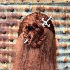 Fashioned to be more than a mere accessory, our Viking Sword Hairpin, showcases a miniature replica of a Viking sword, becomes an extension of your personality, instantly transforming yourself into a fierce Shieldmaiden or a valiant warrior. Not only it makes a stunning adornment for your hair, but it also serves as a symbol of strength and resilience. Embrace your inner warrior and channel the fearless spirit of the Vikings wherever you go. Details Made of zinc alloy Size: 6.3" x 1.5" (16x4 cm) Inner Warrior, Shield Maiden, The Vikings, Bridal Hair, Zinc Alloy, Vikings, Hair Pins, Hair Accessories, Size 6