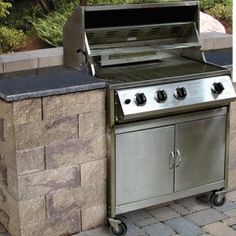 an outdoor bbq grill with two burners and one side door open on a brick patio