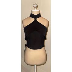 The Top Features A Unique High-Neck Design With A Flattering, Fitted Bodice That Accentuates The Waist. The Fabric Is Smooth And Stretchy, Ensuring A Comfortable Fit While Maintaining A Sleek Silhouette. New With Tags Elegant Black Stretch Crop Top, Black Fitted Elegant Halter Top, Fitted Black Elegant Halter Top, Elegant Fitted Black Halter Top, Formal Black Halter Top, Black Fitted Halter Neck Top, Fitted Black Halter Neck Top, Black Halter Neck Crop Top For Evening, Black Halter Neck Top For Evening