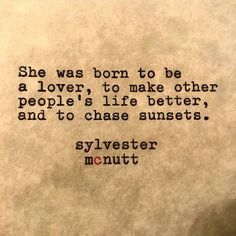 an old typewriter with the words she was born to be a lover, to make other people's life better, and to chase sunsets