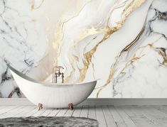 a bathtub sitting on top of a wooden floor next to a white and gold wall