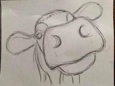 a drawing of a cow's head is shown in this image, it appears to be drawn on paper