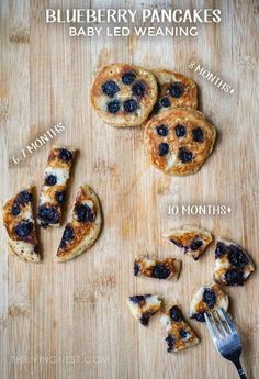 blueberry pancakes with baby led weaning toppings on a wooden cutting board